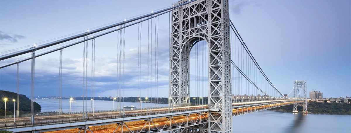 The image features the George Washington Bridge, a major suspension bridge connecting New Jersey and New York City.